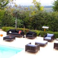 salotto da esterno in acciaio e rattan