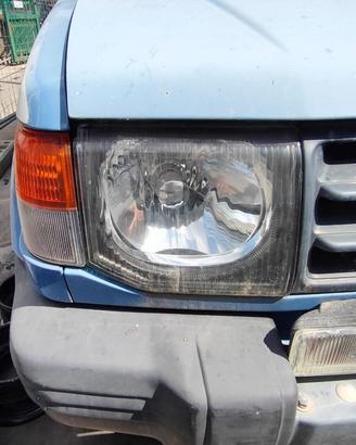 MITSUBISHI PAJERO 1998 FARO ANTERIORE SX/DX