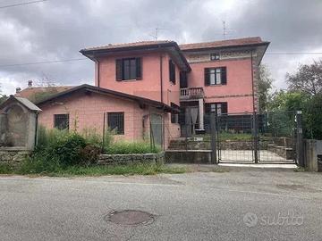 Casa con giardino