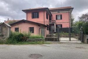 Casa con giardino