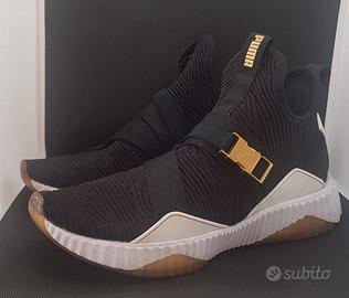 Puma Defy Mid Varsity, black-metallic gold num 38