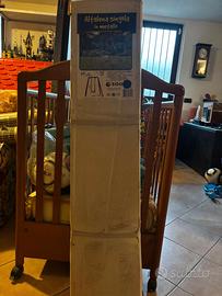 Altalena per bambini in confezione originale.