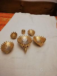 Posacenere dorato riccio design