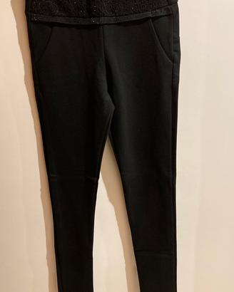 Pantaloni donna stretch con decoro in vita
