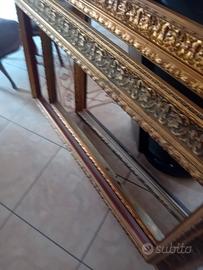 Cornici di legno dorate