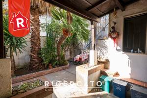 Appartamento al piano terra con scoperto di pertin