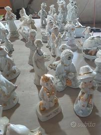 Statuetta in ceramica bianche e oro