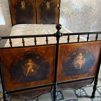 Antico letto in ferro battuto