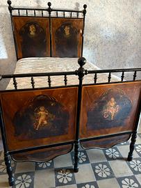 Antico letto in ferro battuto