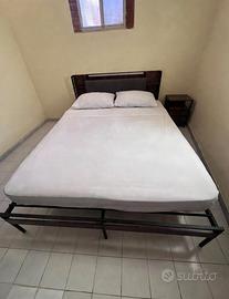 Letto in metallo con testiera contenitore 