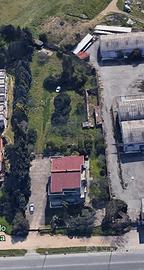 Lotto in zona D1 di 5000mq con fabbricato