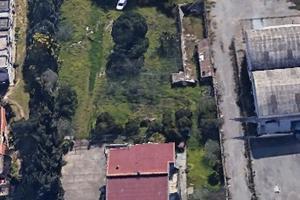 Lotto in zona D1 di 5000mq con fabbricato