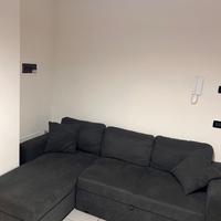 Divano letto con penisola contenitore