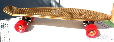 Skateboard Dorato Outdoor ruote arancioni