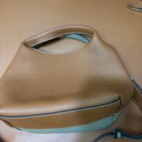 Pelle bovina croce sling bag