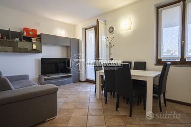 TRILOCALE CON GIARDINO IN RESIDENCE CON PISCINA