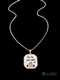 Collana in acciaio dorato con ciondolo con sc