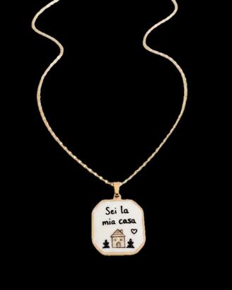 Collana in acciaio dorato con ciondolo con sc