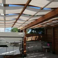 Pergolato con tenda a onda