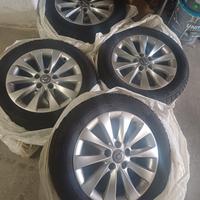 QUATTRO CERCHI IN LEGA ORIGINALI + GOMME QUATTROST