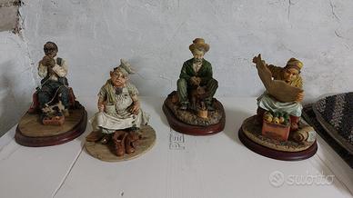 4 Statuite raffiguranti antichi mestieri