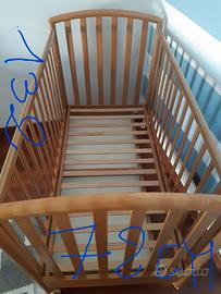 Lettino in legno 0/6 anni con cassetto e rotelle