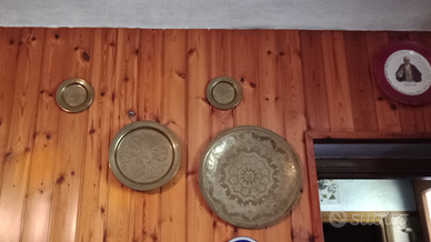 Piatti in metallo decorativi