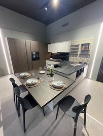 Cucina ArDue effetto resina con penisola e tavolo