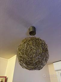 Lampadario in acciaio intrecciato