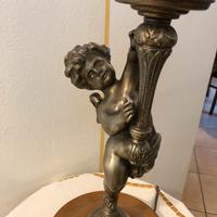 Putto portalampada in metallo