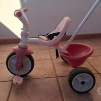 Triciclo Smoby rosa con canna parentale