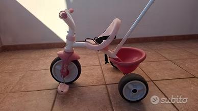 Triciclo Smoby rosa con canna parentale