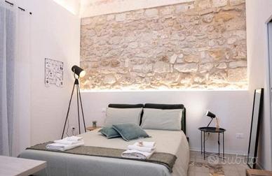 Camere con bagno privato a studenti universitari