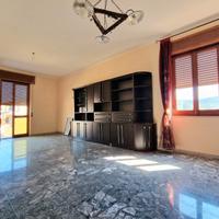 Ampio quadrilocale con giardino di pertinenza