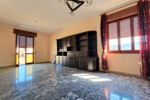 Ampio quadrilocale con giardino di pertinenza