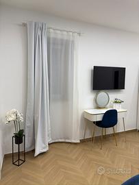 Camera con cucina esterna