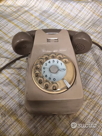Telefono fisso a rotella da parete Sip vintage.