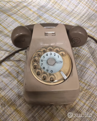 Telefono fisso a rotella da parete Sip vintage.