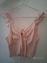 Top rosa chiaro arricciato. Taglia S