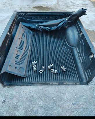 copricassone Mitsubishi l200 06-15