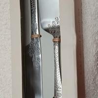 paletta e coltello color argento 