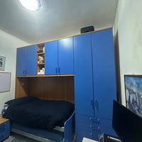 Camera colombini con letto e armadio a ponte