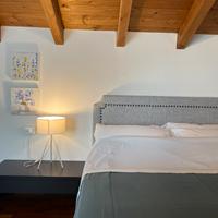 Testiera letto con rivestimento in tela