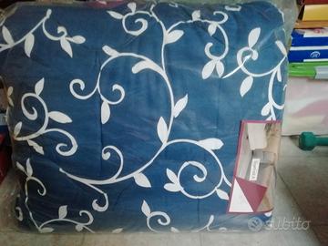 Trapunta e lenzuola matrimoniale