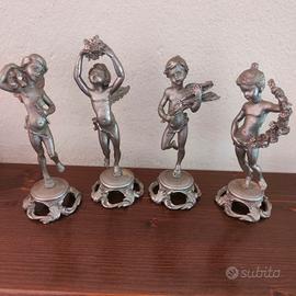 Putti in peltro cesellato 