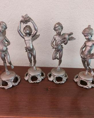 Putti in peltro cesellato 