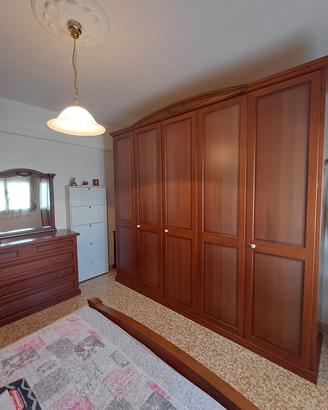 camera da letto in legno stile arte povera
