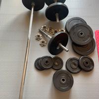 Panca, bilancieri e dischi per palestra