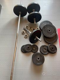 Panca, bilancieri e dischi per palestra