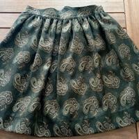Gonna verde scuro con motivi dorati